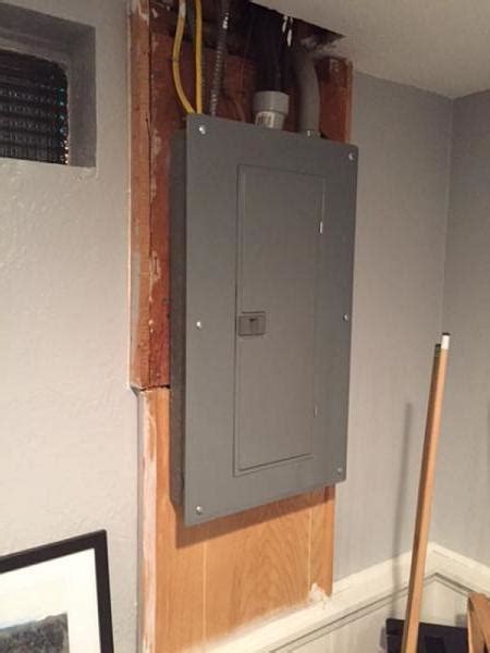 add enclosure over electrical panel|cabinet over electrical panel.